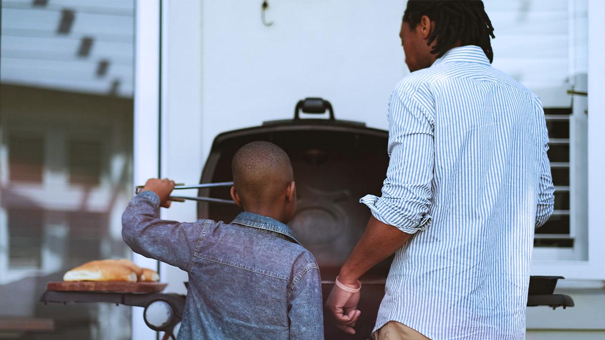 person and child at a bbq